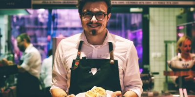 friendly waiter serving food